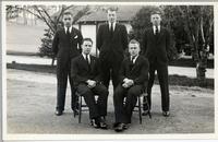 [Group portrait of five men in an unknown location]