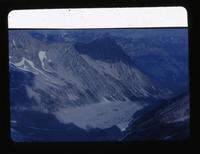 [View of numerous mountains with a gully in the foreground]