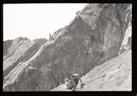 [Two people on the side of a mountain] Sept. 1947