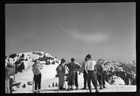 [A mountaineering group standing on a mountain]
