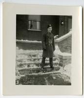 [Richard Chambers wearing a uniform while standing on a stairway in front of a building]