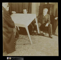 Séance with the Medium Eusapia Palladino; Men Seated Around Floating Table