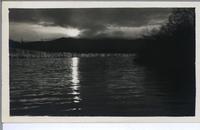 [View of a sunset over a lake or bay in an unknown location]
