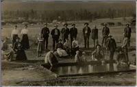 [Group of men, women and children around a small man-made pond in Nanaimo, B.C.]