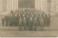 [Group portrait of men on the steps in front of the British Columbia Parliament Buildings in Victoria, B.C.]