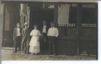 [Group portrait of four men and a woman in front of the Kootenay Restaurant in Rossland, B.C.]