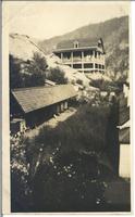 [View of a dwelling on a hillside in an unknown location]