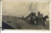[Tractor in a field in an unknown location]