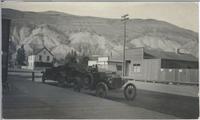 [Two automobiles parked on a street in Ashcroft, B.C.]