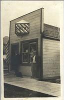 [Two men in front of Bath's barber shop in Athalmer, B.C.]