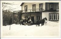 [Horse drawn sleigh full of people in front of a dwelling near Duncan, B.C.]