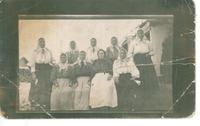 [Group portrait of nine Doukhobor women in an unknown location]
