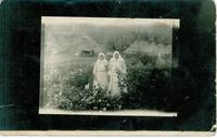 [Two Doukhobor women standing in a garden in an unknown location]