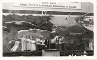 [Several Doukhobor men and women on stage at the Jubilee Fiftieth Anniversary Doukhobors in Canada]