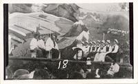 [Group of Doukhobor men and women sitting on stage at the Jubilee Fiftieth Anniversary Doukhobors in Canada]