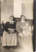 [Group portrait of two Doukhobor women and an infant in an unknown location]