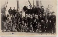 [Group portrait of Doukhobors on the Empress of Scotland in an unknown location]