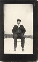 [Portrait of a Doukhobor man sitting on a chair in an unknown location]