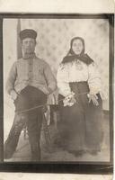 [Portrait of a Doukhobor man and woman sitting in an unknown location]