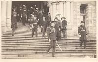 [Men walking down stairs of British Columbia Parliament Buildings in Victoria, B.C.]