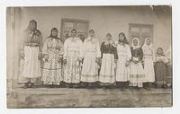 [Photographic postcard of ten Doukhobor girls in traditional dress, c. 1909]