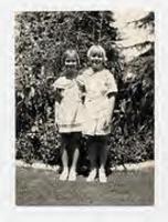 [Photograph of two girls in a garden, c. 1940s]