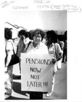 [Woman holding a "Pensions now not later!!!" sign]