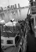 [Several people boarding a Canadian Coast Guard vessel]