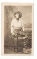 Portrait of young man in cowboy outfit