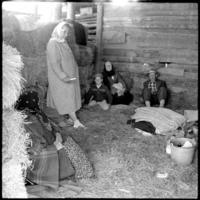 Doukhobor family sitting on hay