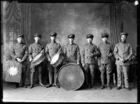 Group portrait of seven Chinese men in military band