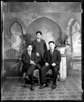 Studio portrait of three Chinese men