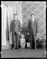Studio portrait of two Chinese men