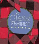 thumbnail of checkered shirt with label Secret feminist  agenda
